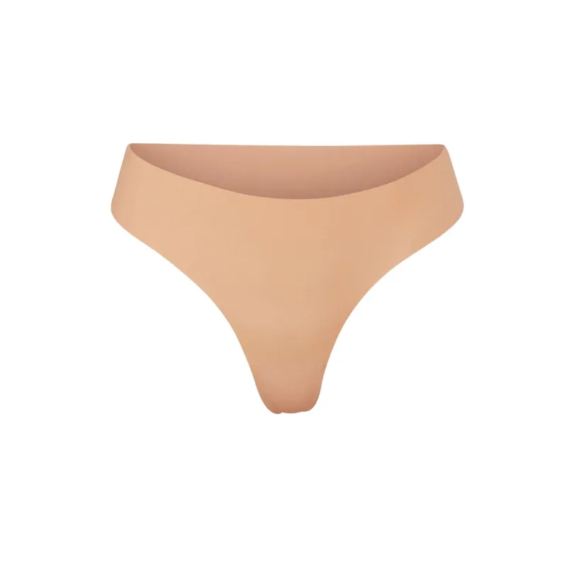 NAKED DIPPED THONG | OCHRE sold by SKIMS