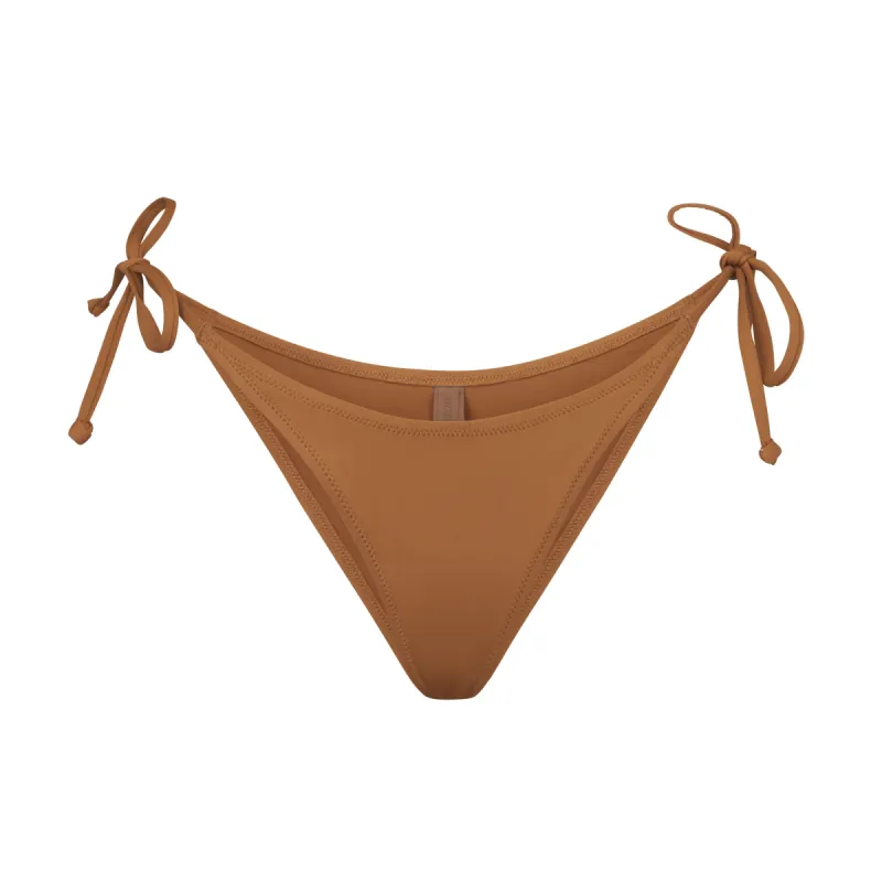 SIGNATURE SWIM DIPPED TIE BOTTOM | ALMOND sold by SKIMS