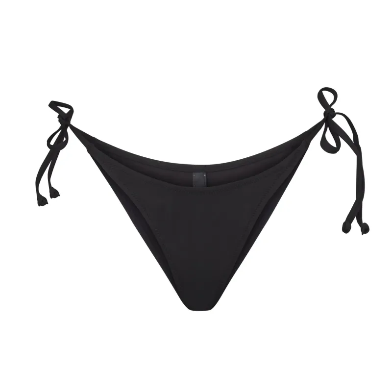SIGNATURE SWIM DIPPED TIE BOTTOM | ONYX sold by SKIMS