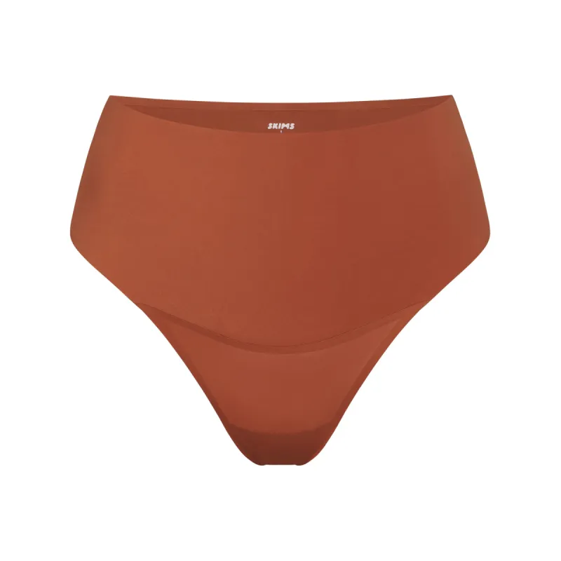 SMOOTHING INTIMATES HIGH-WAISTED THONG | BRONZE sold by SKIMS
