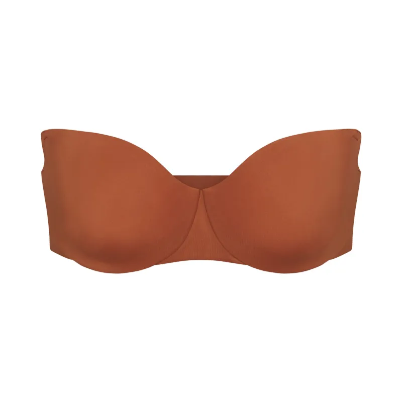 SMOOTHING INTIMATES UNLINED STRAPLESS BRA | BRONZE sold by SKIMS