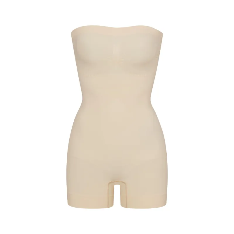 SEAMLESS SCULPT STRAPLESS SHORTIE BODYSUIT | SAND sold by SKIMS