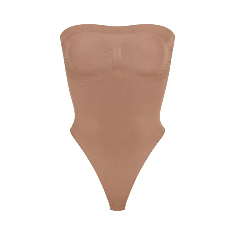 SEAMLESS SCULPT STRAPLESS THONG BODYSUIT | SIENNA sold by SKIMS