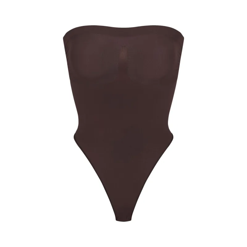 SEAMLESS SCULPT STRAPLESS THONG BODYSUIT | ESPRESSO sold by SKIMS