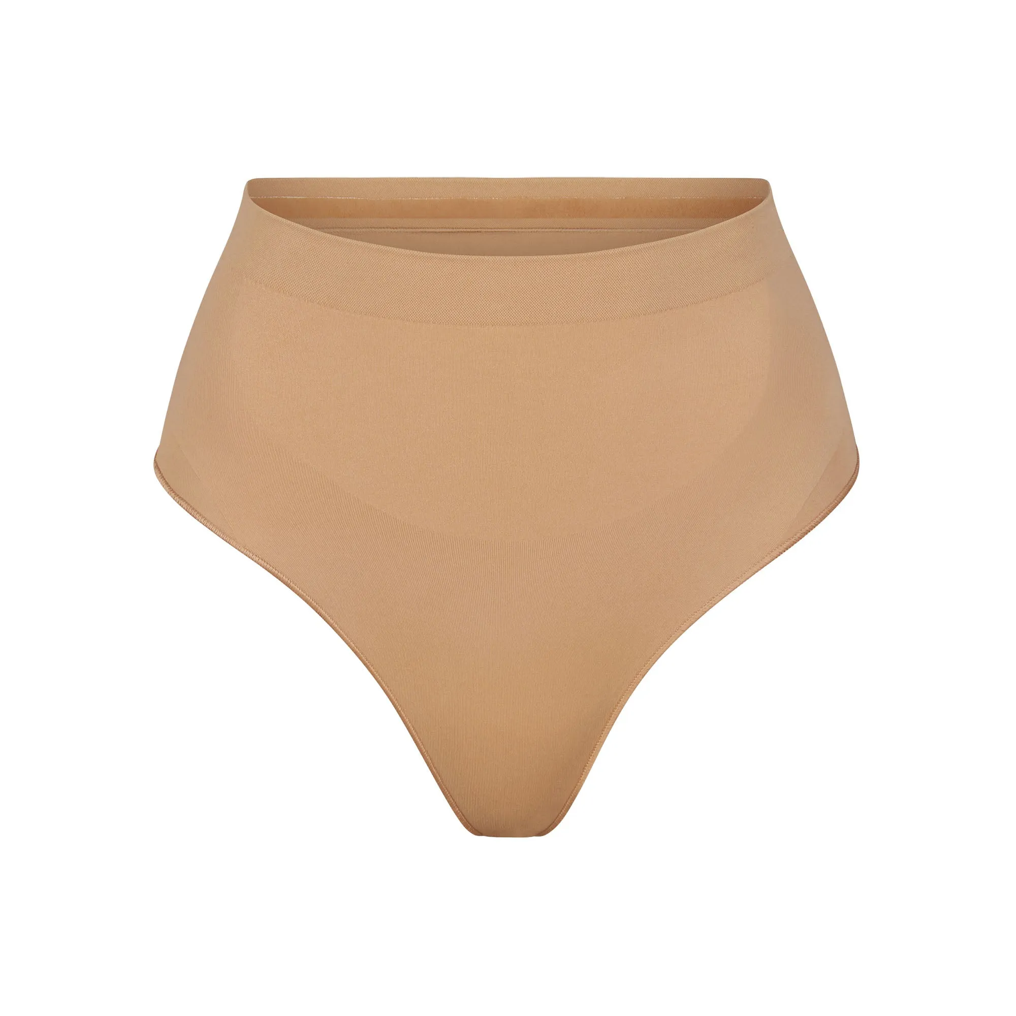 SEAMLESS SCULPT MID WAIST THONG | OCHRE sold by SKIMS