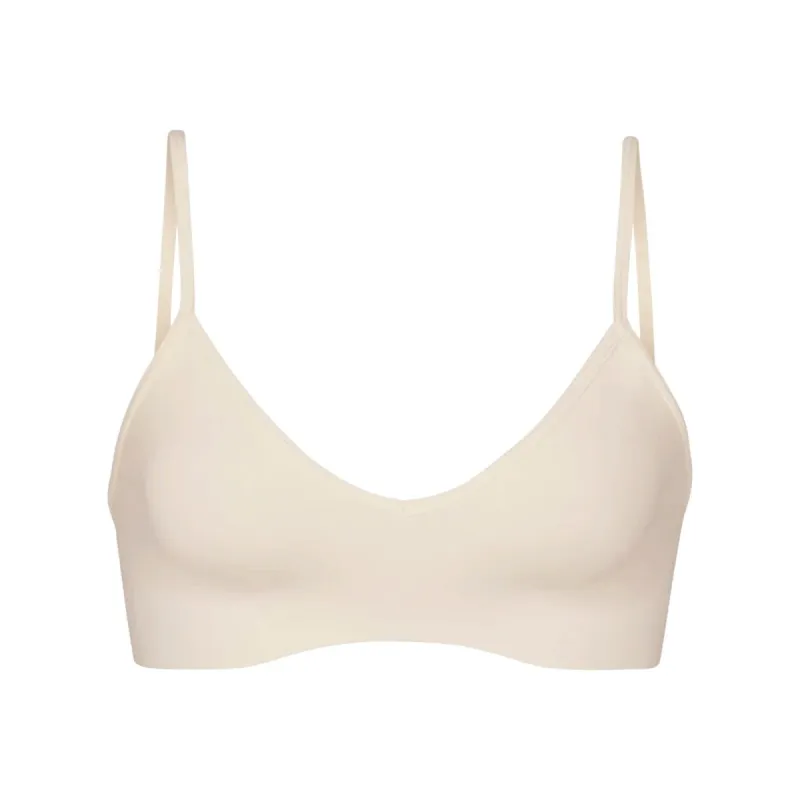SOFT SMOOTHING SEAMLESS BRALETTE | SAND sold by SKIMS