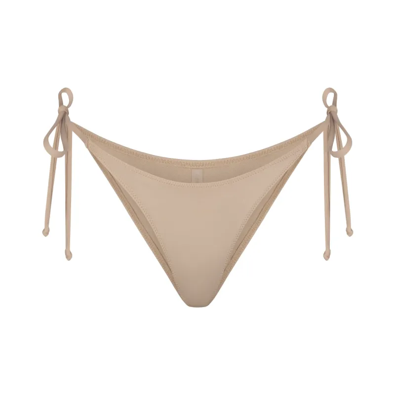 SIGNATURE SWIM DIPPED TIE BOTTOM | DESERT sold by SKIMS