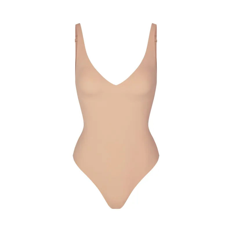 NAKED PLUNGE THONG BODYSUIT | CLAY sold by SKIMS