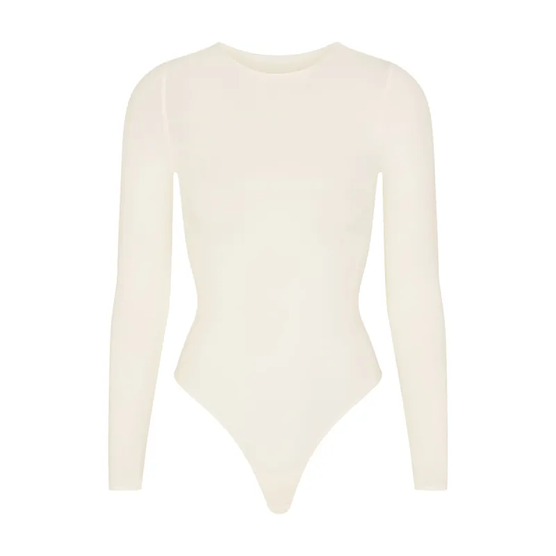 ESSENTIAL CREW NECK LONG SLEEVE BODYSUIT | ECRU sold by SKIMS
