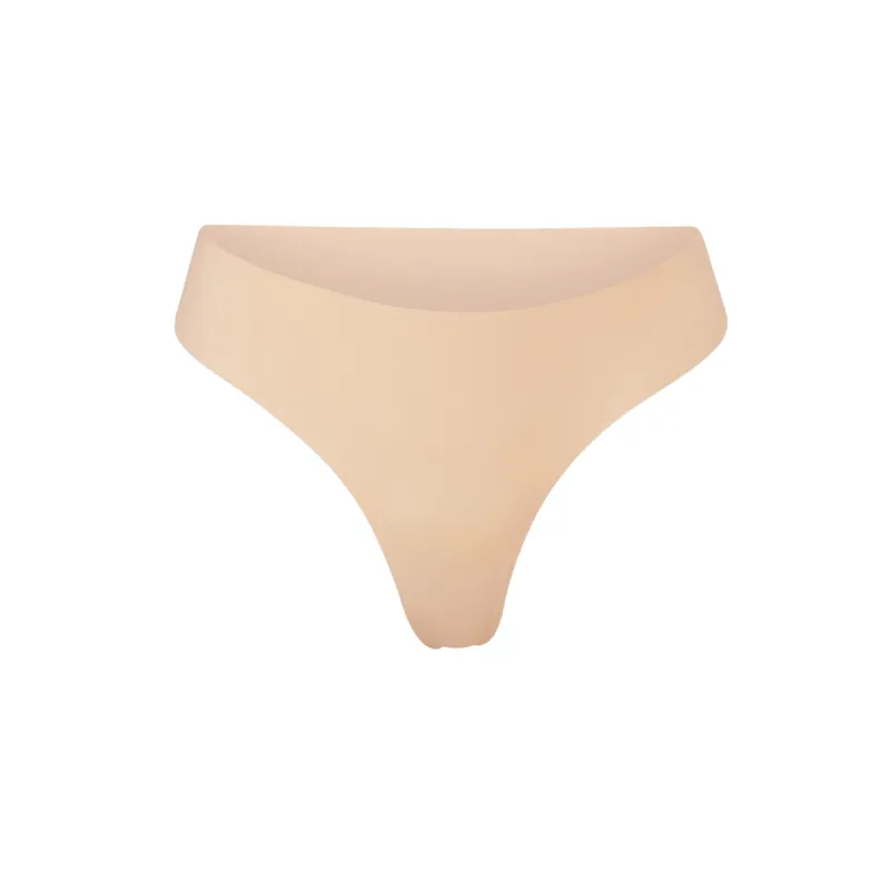 NAKED DIPPED THONG | CLAY sold by SKIMS
