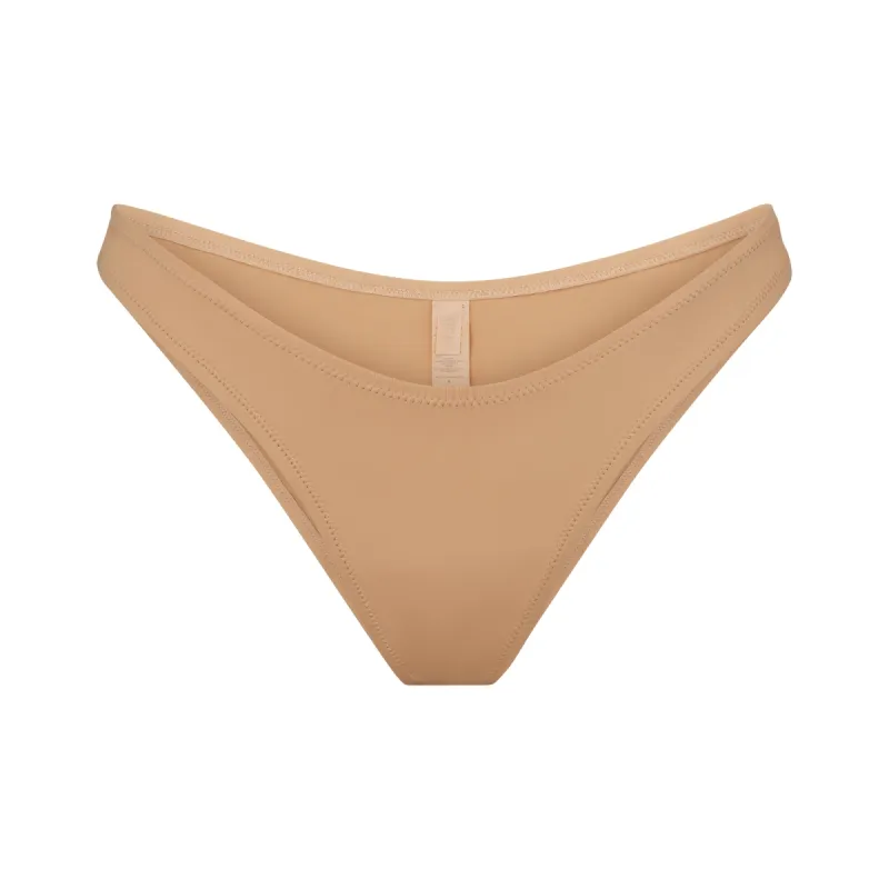 SIGNATURE SWIM CHEEKY TANGA BOTTOM | OCHRE sold by SKIMS
