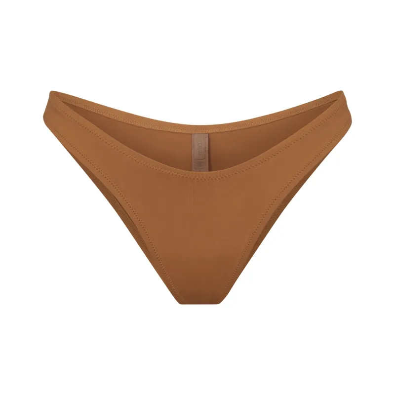 SIGNATURE SWIM CHEEKY TANGA BOTTOM | ALMOND sold by SKIMS
