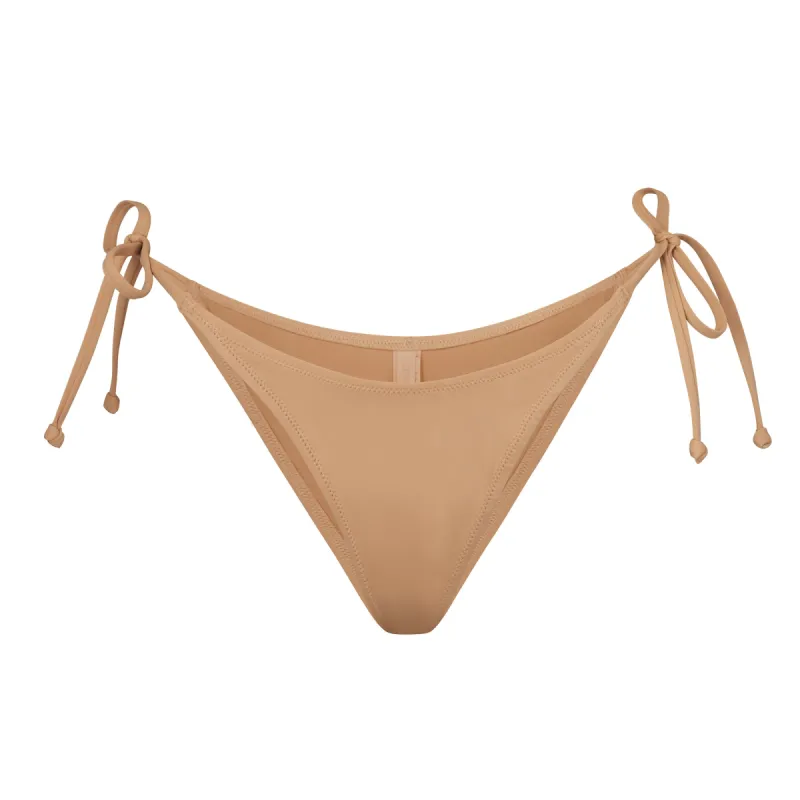 SIGNATURE SWIM DIPPED TIE BOTTOM | OCHRE sold by SKIMS