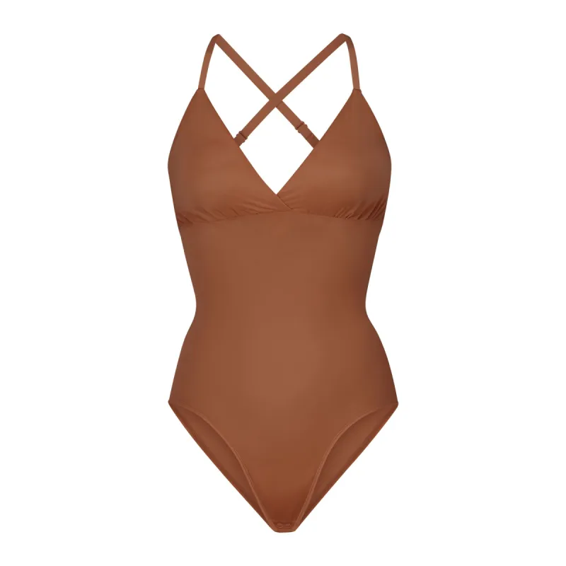 SIMPLY BARE BODYSUIT BRIEF W/ SNAPS | BRONZE sold by SKIMS