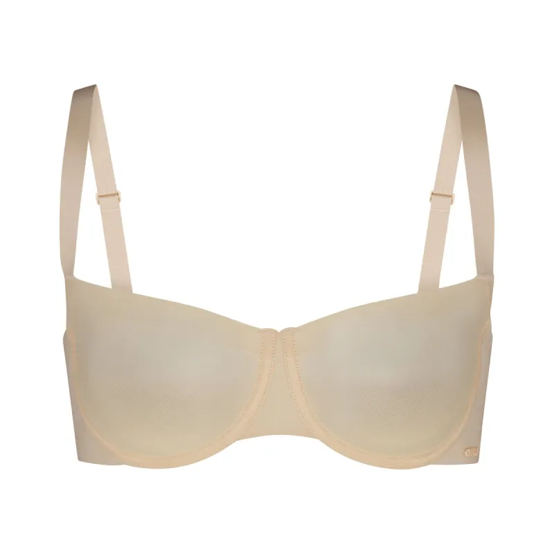NO SHOW UNLINED BALCONETTE BRA | SAND sold by SKIMS