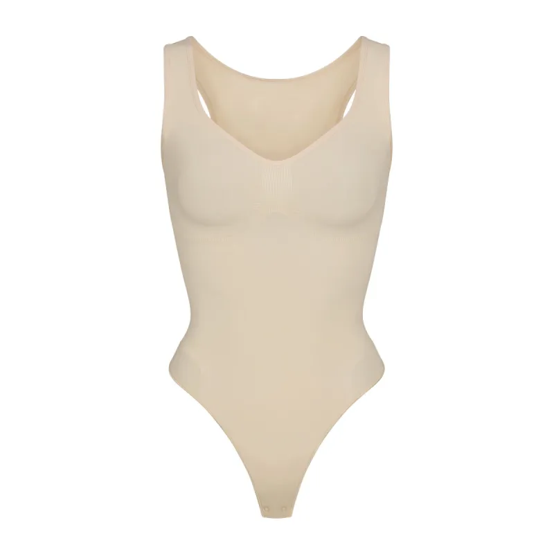 SEAMLESS SCULPT SCOOP NECK THONG BODYSUIT | SAND sold by SKIMS