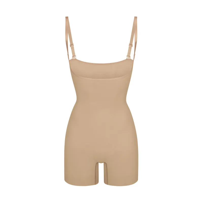 SEAMLESS SCULPT OPEN BUST SHORTIE BODYSUIT | CLAY sold by SKIMS