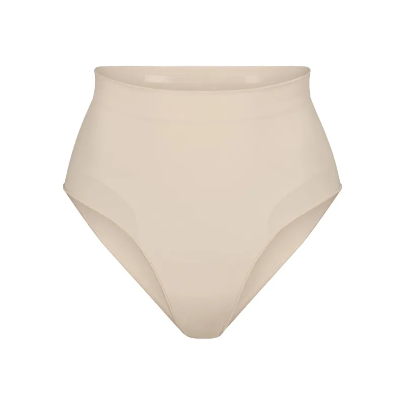 SEAMLESS SCULPT MID WAIST BRIEF | SAND sold by SKIMS
