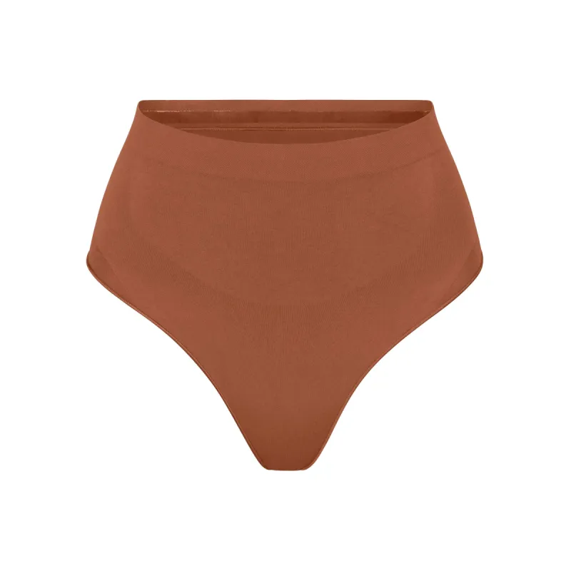 SEAMLESS SCULPT MID WAIST THONG | BRONZE sold by SKIMS