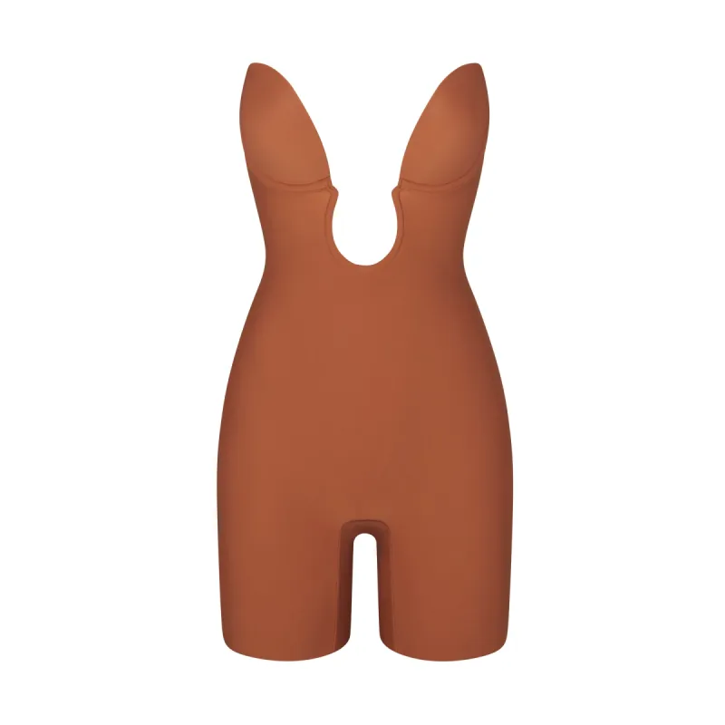 DEEP PLUNGE SHAPEWEAR MID THIGH BODYSUIT | BRONZE sold by SKIMS