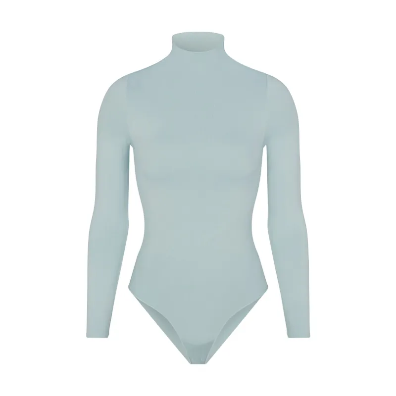 ESSENTIAL MOCK NECK LONG SLEEVE BODYSUIT | DENIM sold by SKIMS