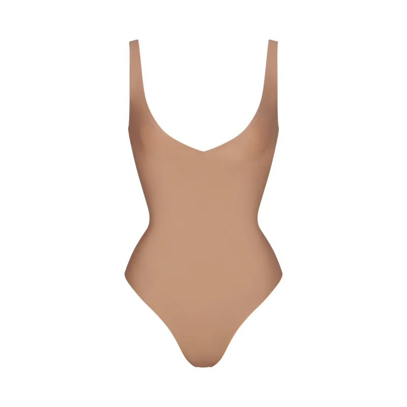 SKIMS BODY UNLINED PLUNGE THONG BODYSUIT | SIENNA sold by SKIMS