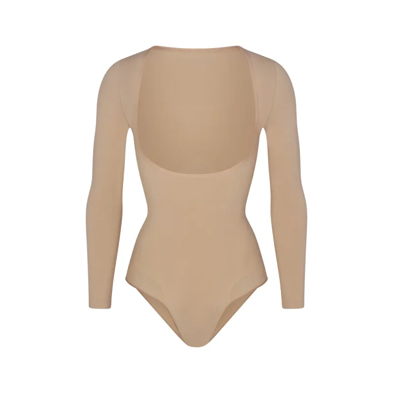 SEAMLESS SCULPT LONG SLEEVE OPEN BUST BRIEF BODYSUIT | CLAY sold by SKIMS