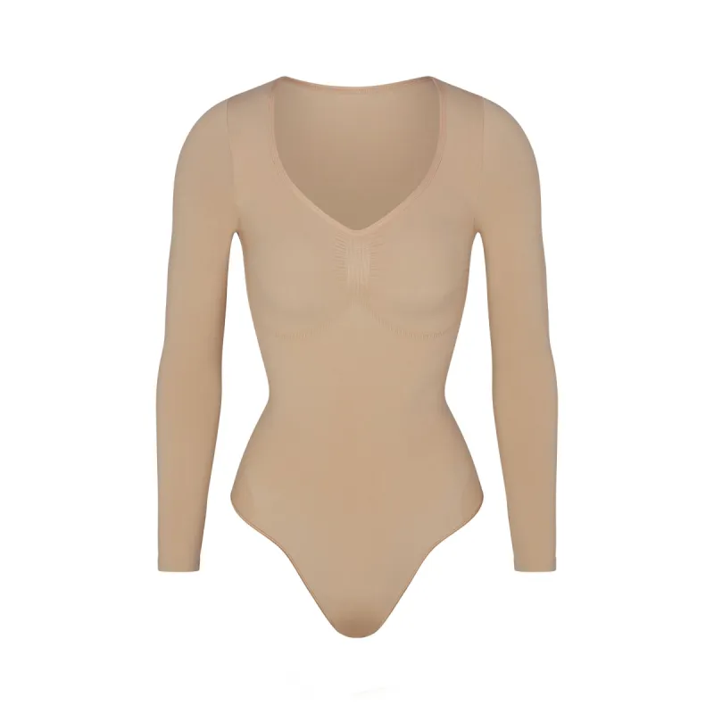 SEAMLESS SCULPT LONG SLEEVE THONG BODYSUIT | CLAY sold by SKIMS