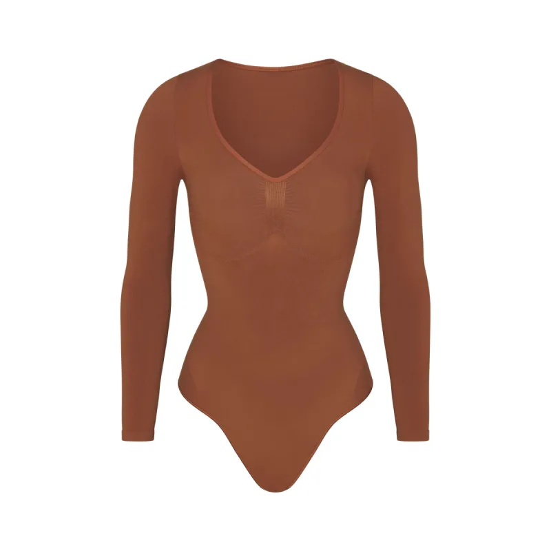 SEAMLESS SCULPT LONG SLEEVE THONG BODYSUIT | BRONZE sold by SKIMS