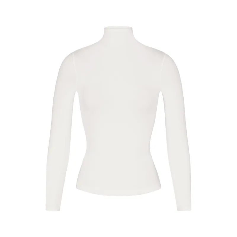 COTTON JERSEY LONG SLEEVE TURTLENECK | MARBLE sold by SKIMS