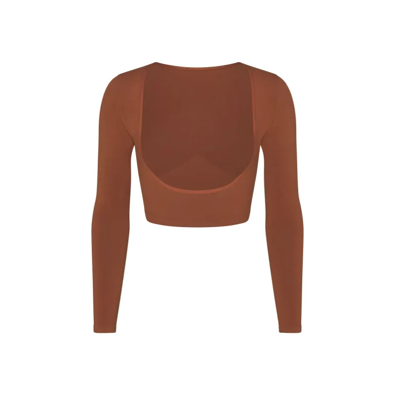 SEAMLESS SCULPT OPEN BUST ARM SHAPER | BRONZE sold by SKIMS