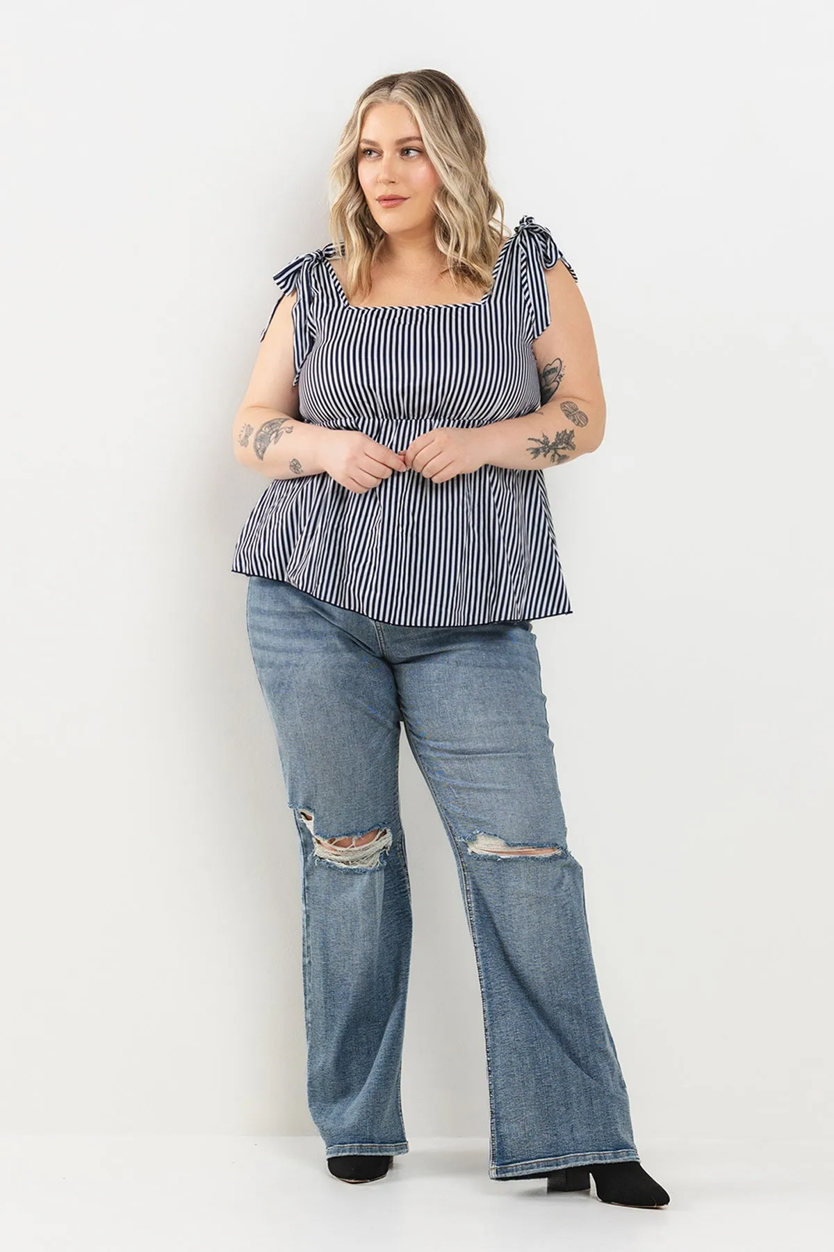 MID RISE DISTRESSED KICK FLARE JEANS - PLUS sold by Sneak Peek