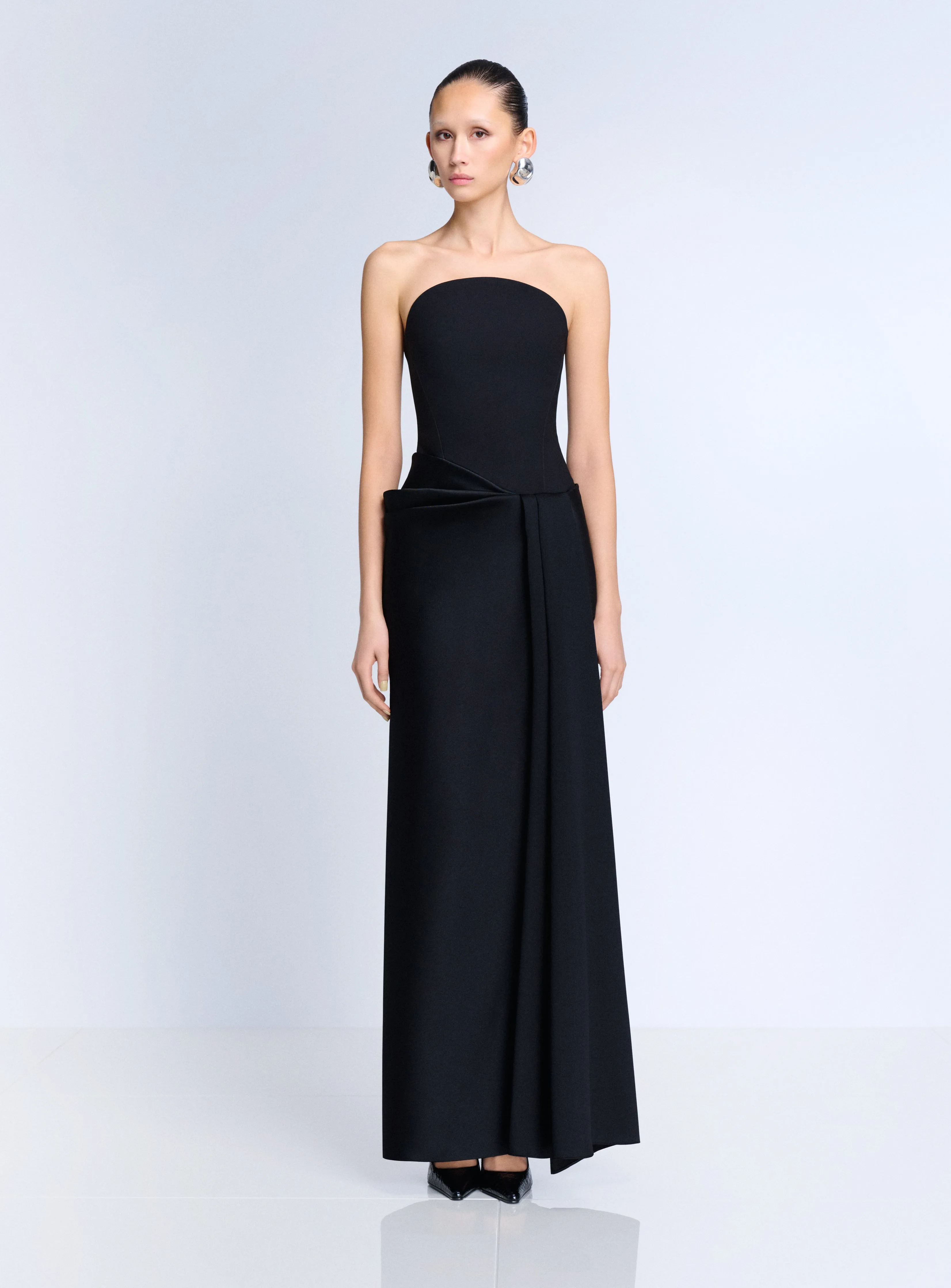 The Seri Maxi Dress in Black sold by Solace London