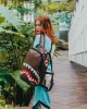 SHARKS AND SKULLS BACKPACK (DLXV) sold by Sprayground