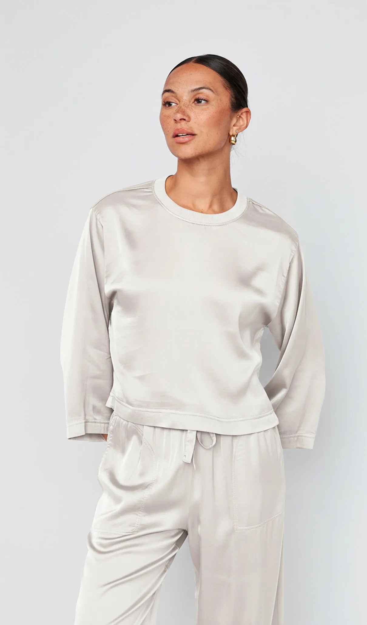 Cosmo Satin Crewneck Top in Cream sold by Stateside