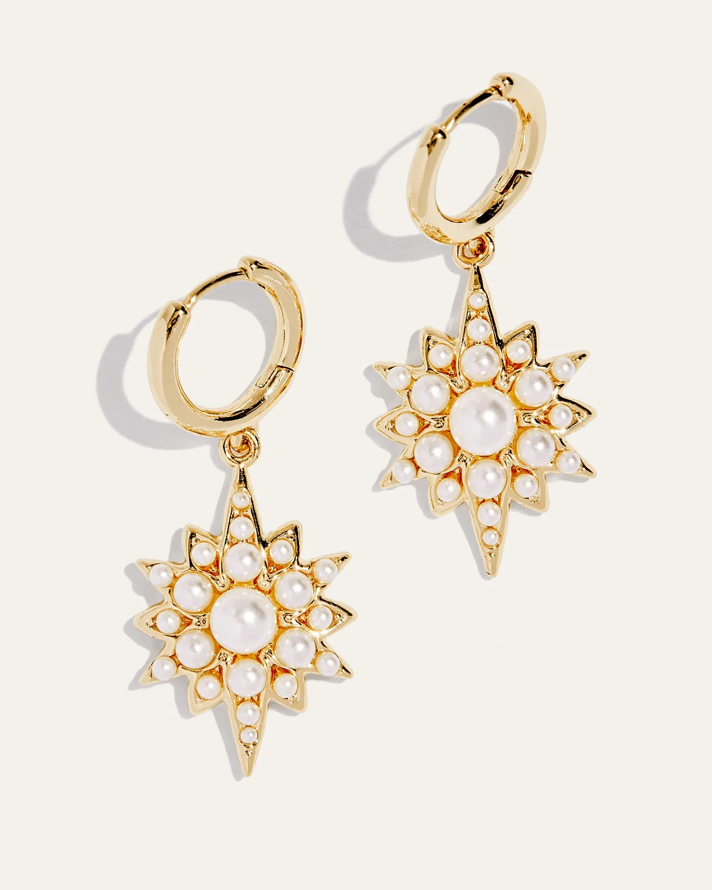 Celestial Pearl Charm Huggie Earrings sold by Stella & Dot