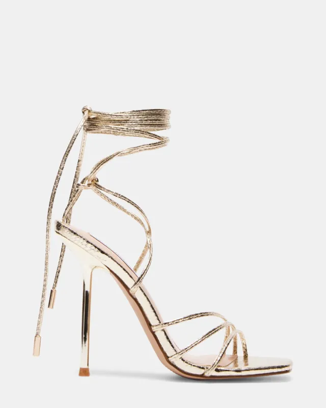 EVITA GOLD SNAKE sold by Steve Madden