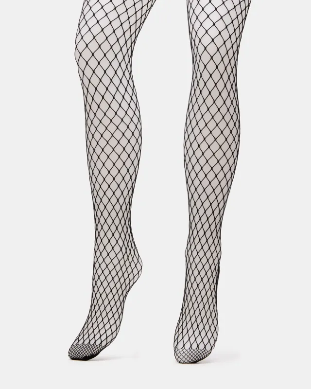 FISHNET TIGHTS BLACK sold by Steve Madden