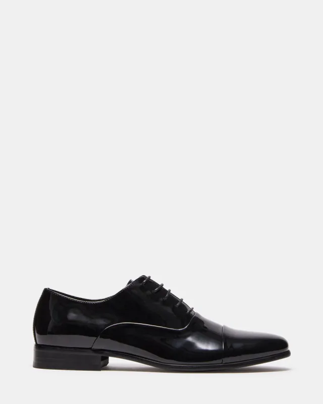 DOMINIK BLACK PATENT sold by Steve Madden