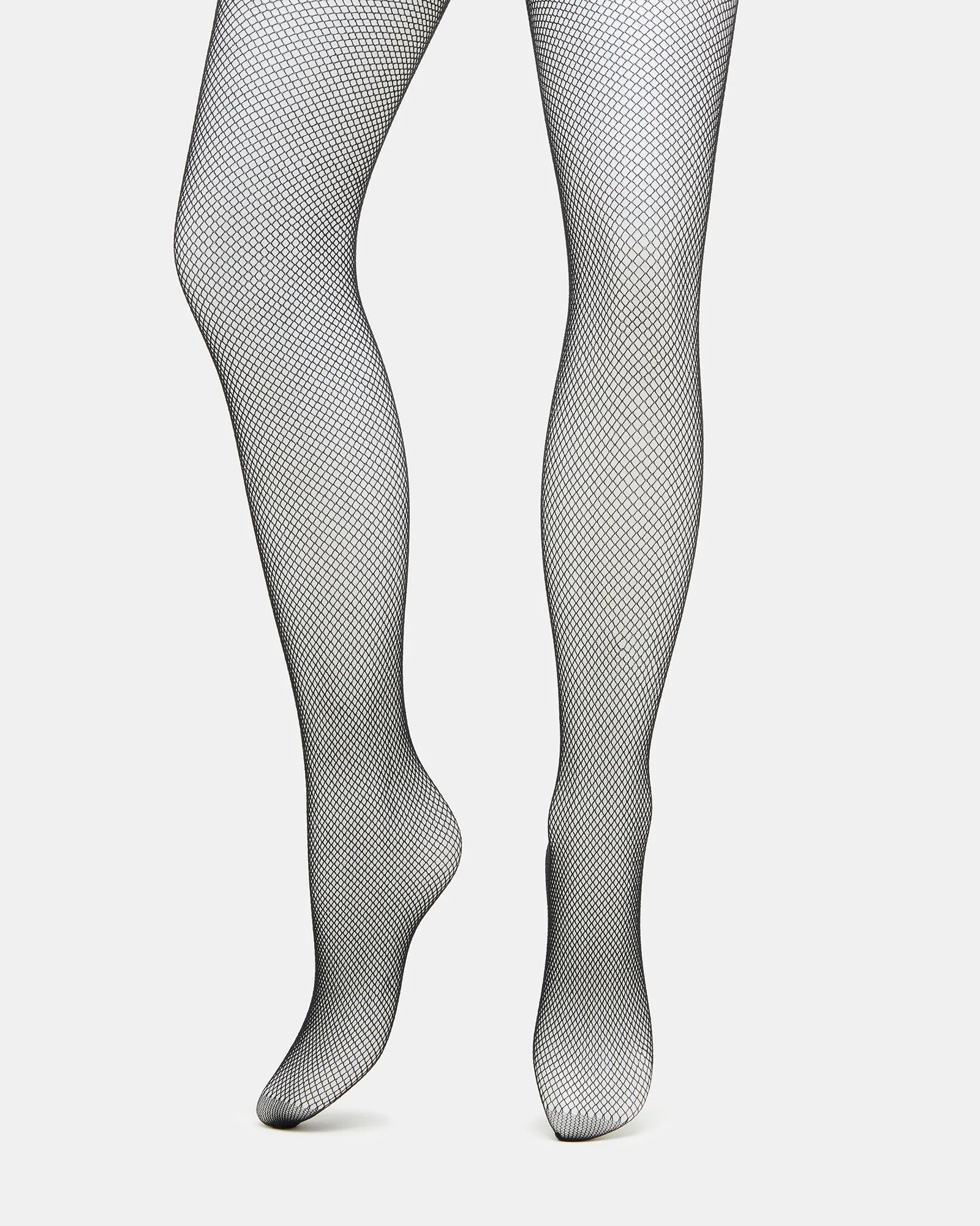 MINI FISHNET TIGHTS BLACK sold by Steve Madden