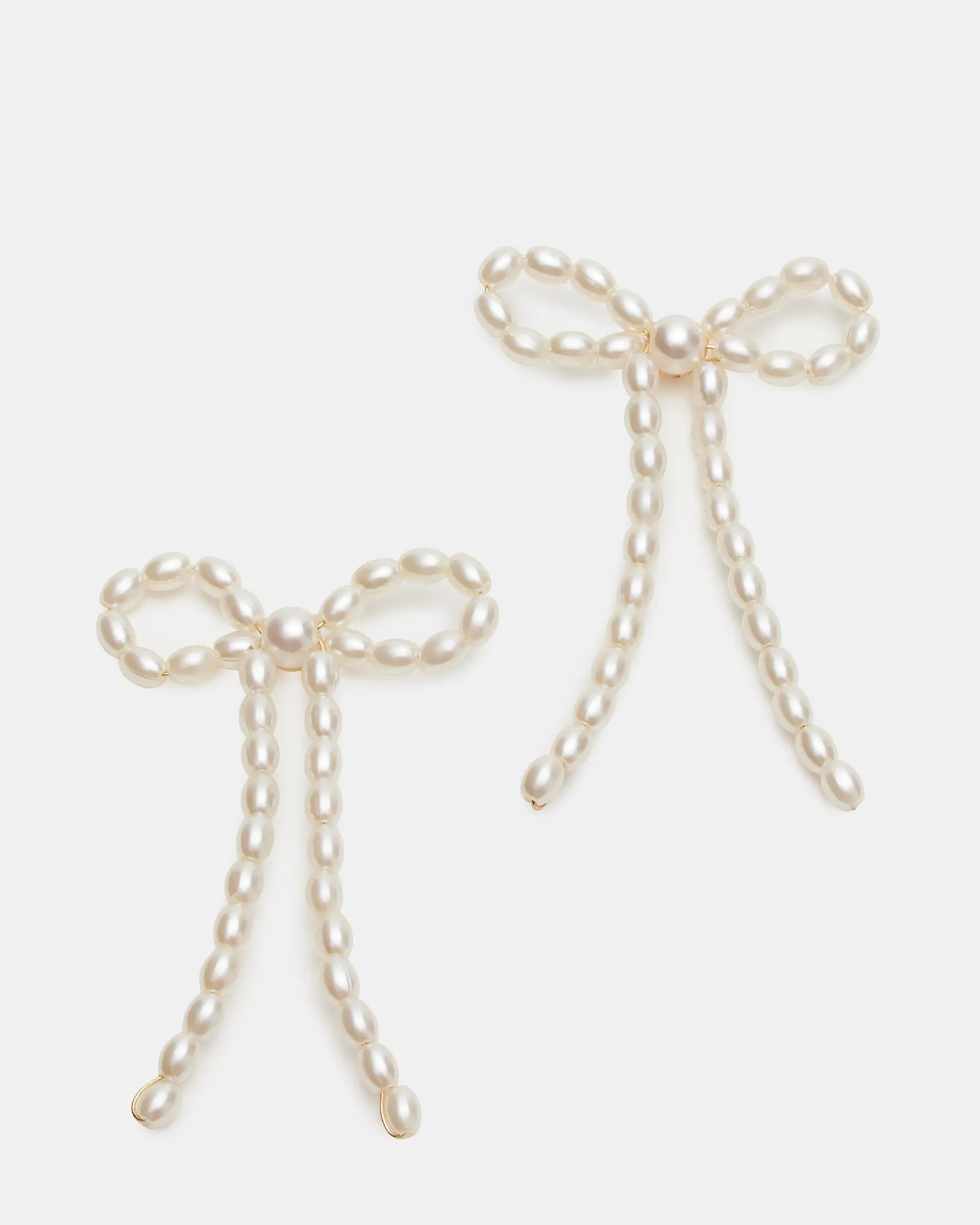 PEARL BOW EARRINGS IVORY sold by Steve Madden