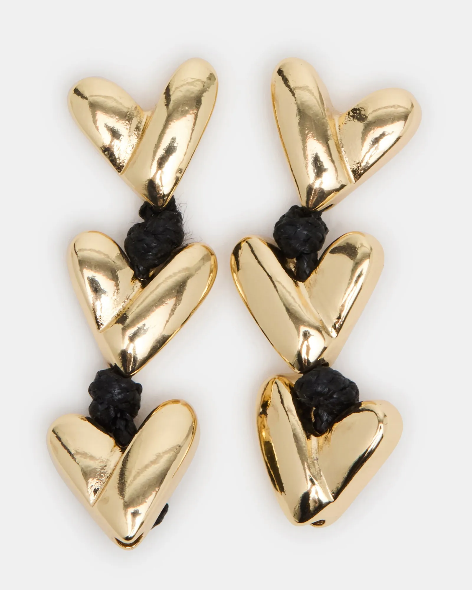 HEART LINEAR EARRINGS BLACK/GOLD sold by Steve Madden