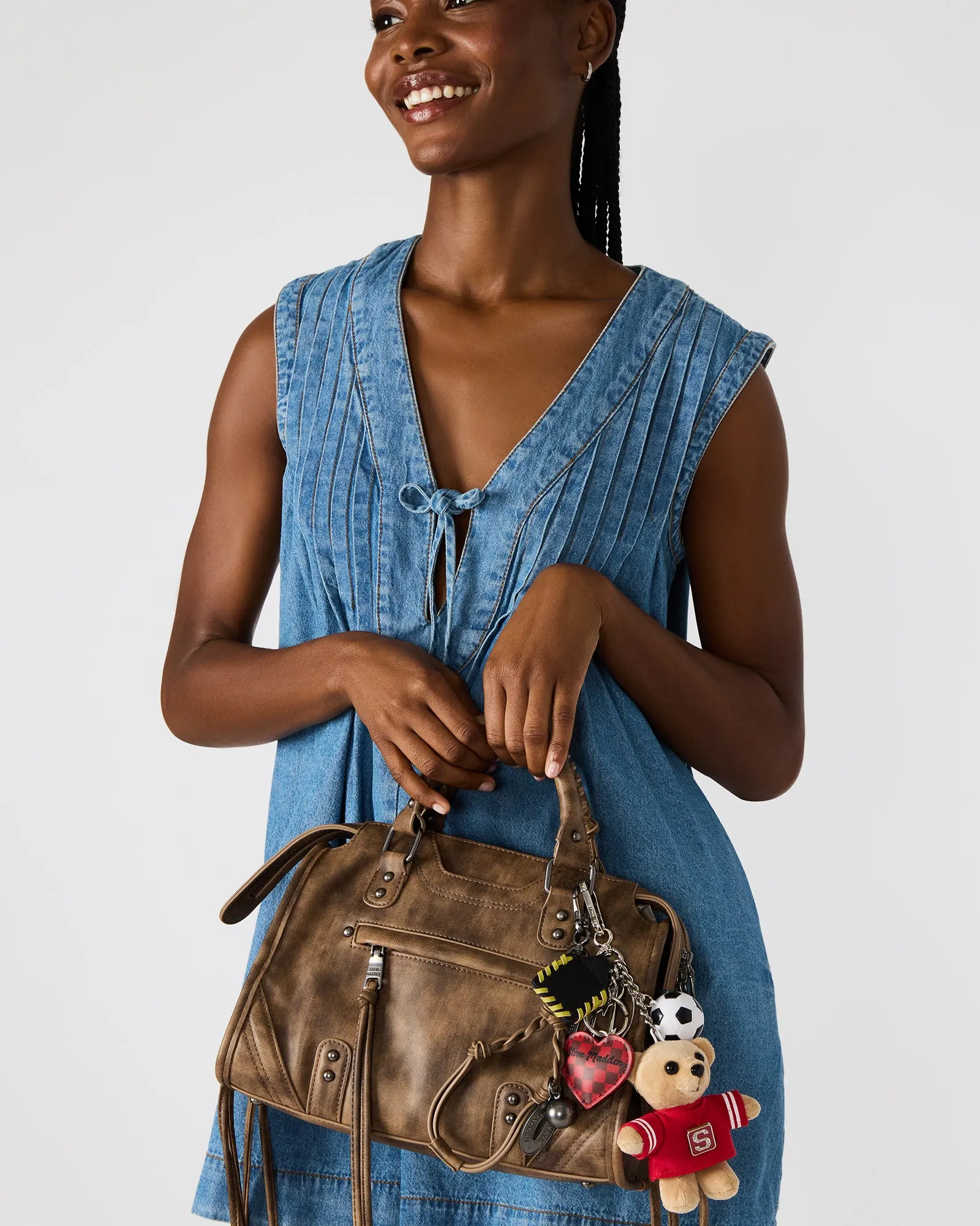 RIGGS BAG BROWN AND BAG CHARM BUNDLE sold by Steve Madden