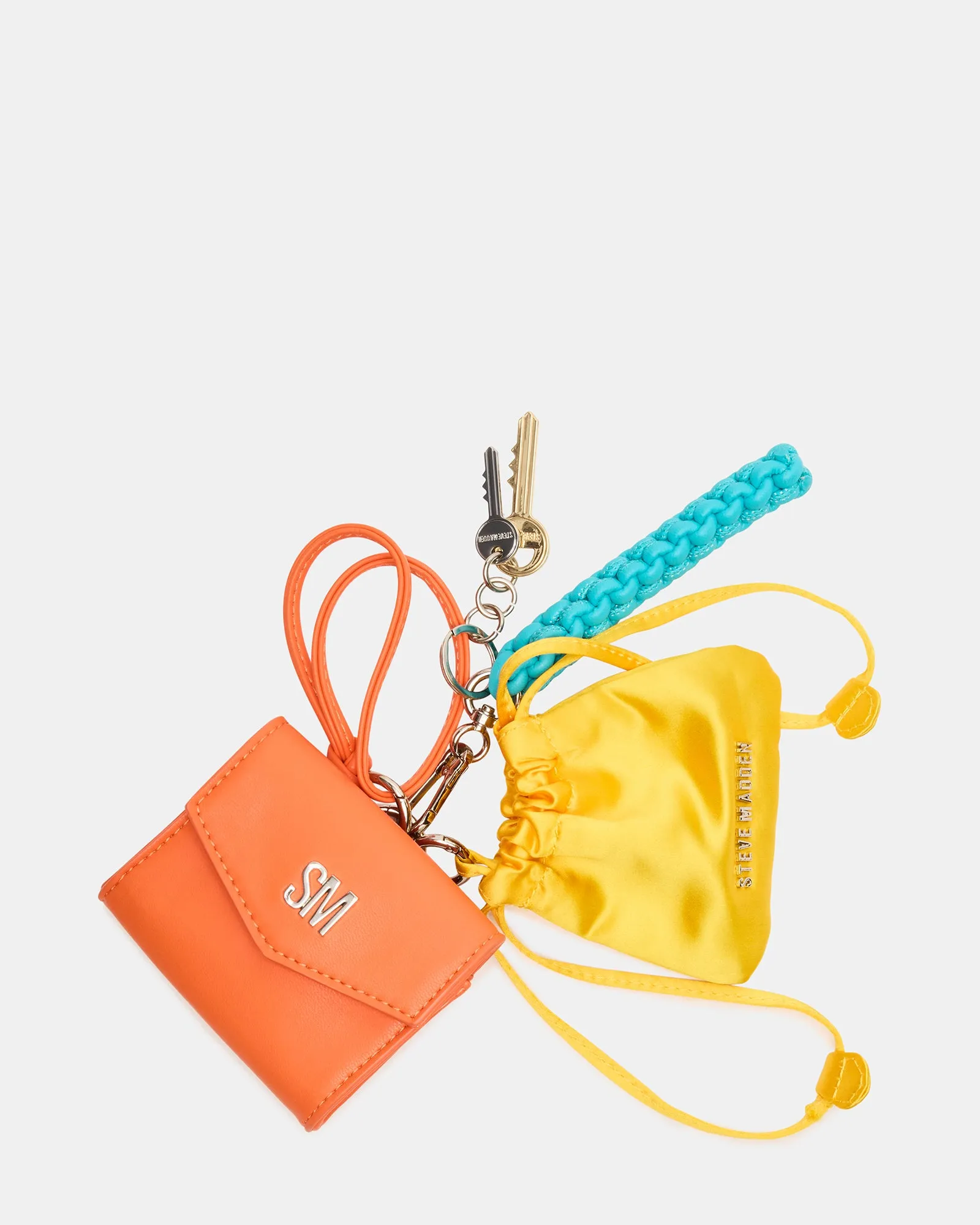 TRAVEL BAG CHARM ORANGE MULTI sold by Steve Madden