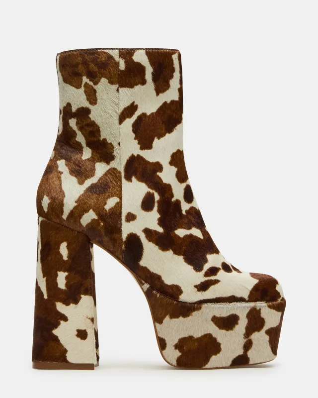 TRILLION BROWN COW PRINT sold by Steve Madden