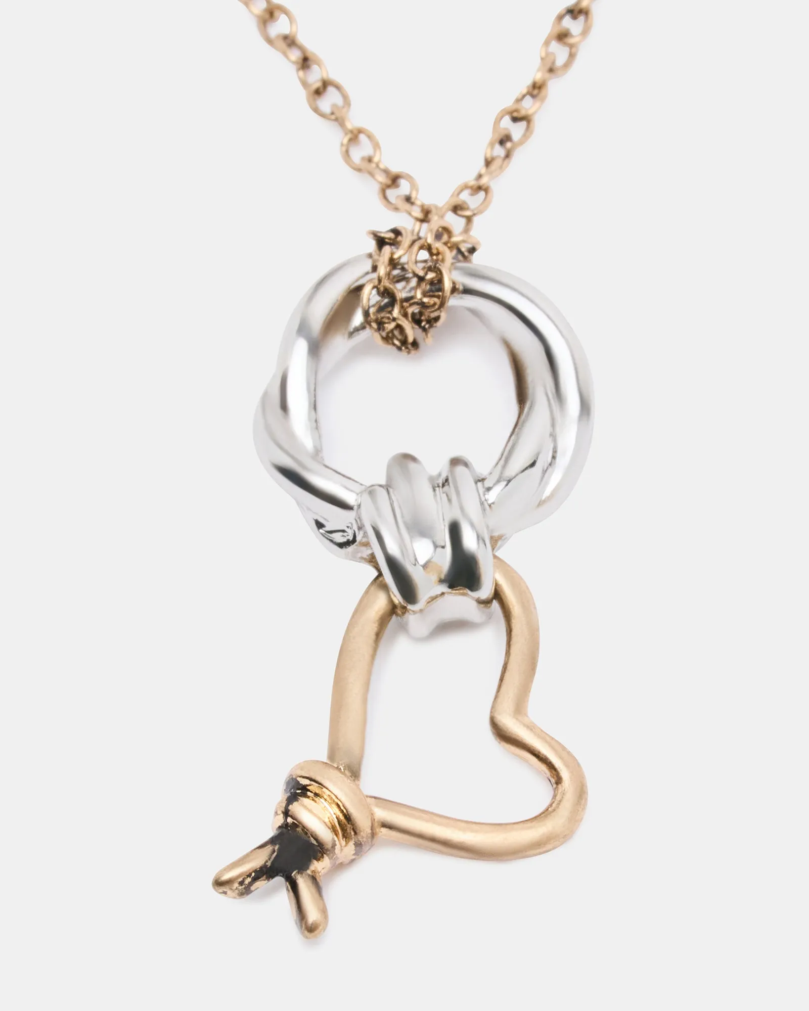 TWO TONE KNOT HEART PENDANT NECKLACE sold by Steve Madden product image thumbnail 2