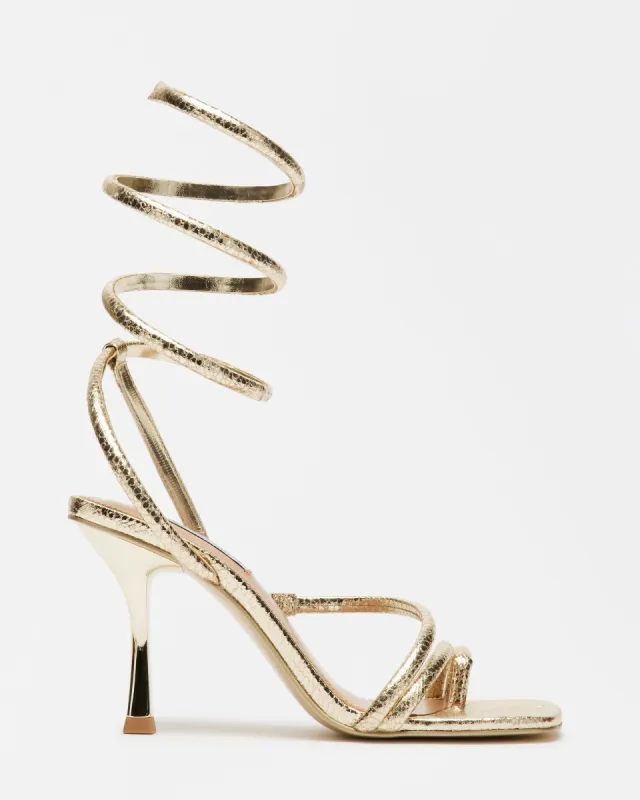 SHANTELLE GOLD SNAKE sold by Steve Madden