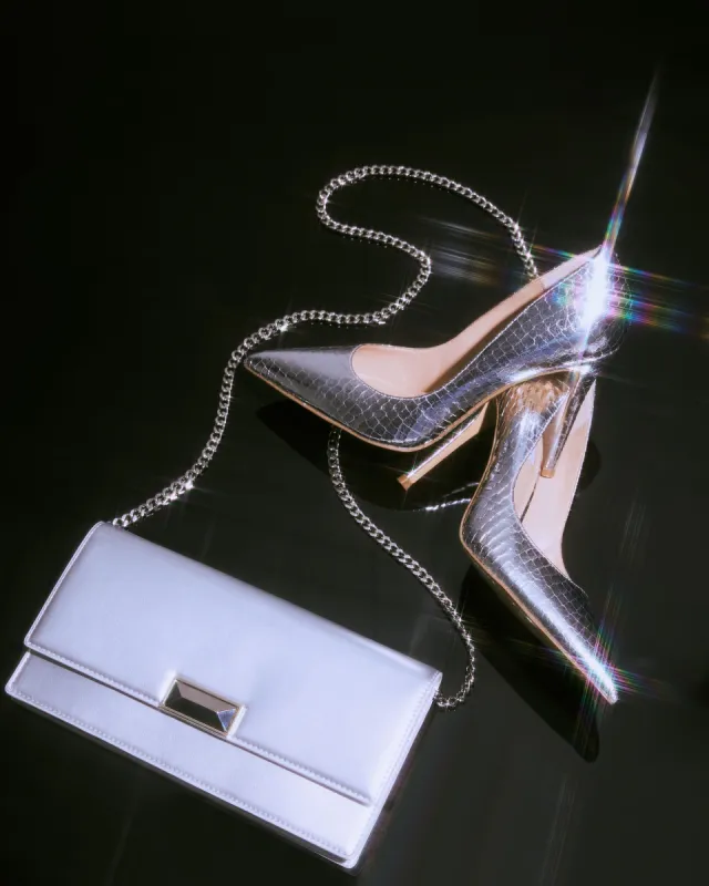 SHOP THE LOOK EVELYN SILVER SNAKE + MODEL BAG SILVER sold by Steve Madden