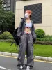 Y2K oversized parachute cargo pants sold by Streetwear Society