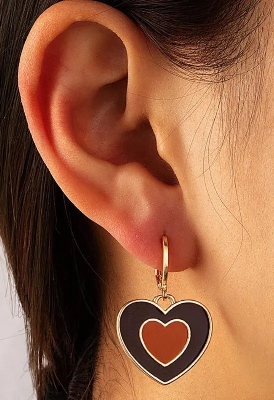 Heart-shaped dangling earrings sold by Streetwear Society